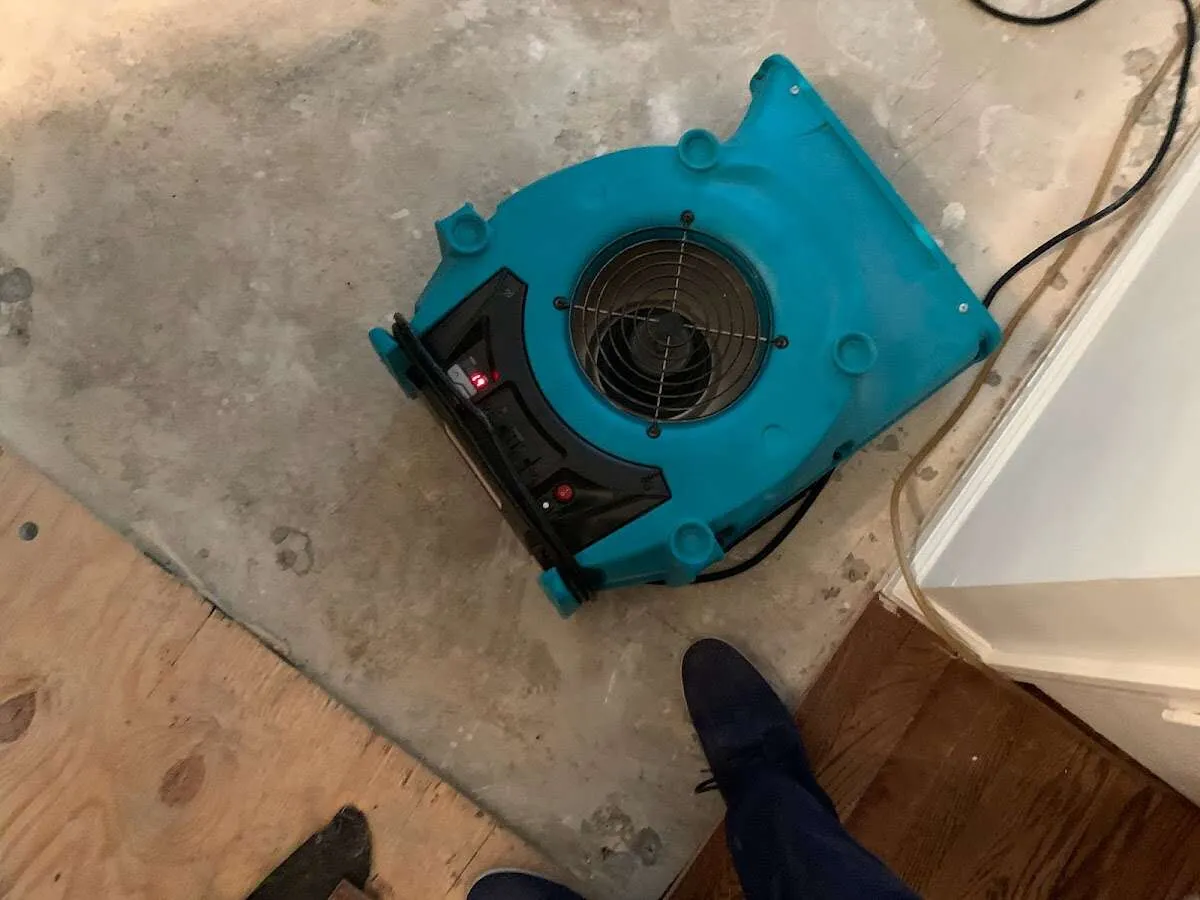 Air mover drying subfloor during Leak Detection & Repair in Rockcreek